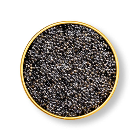 Sterlet caviar in a glass jar with mother-of-pearl spoon on a wooden surface