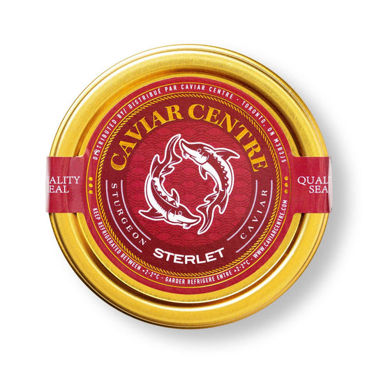 Sterlet caviar in a container with mother-of-pearl spoon on a serving board